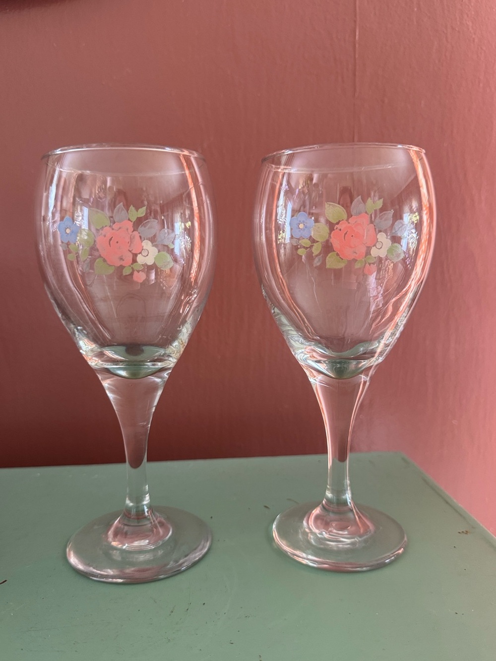 Vintage hand-painted wine glasses with floral design